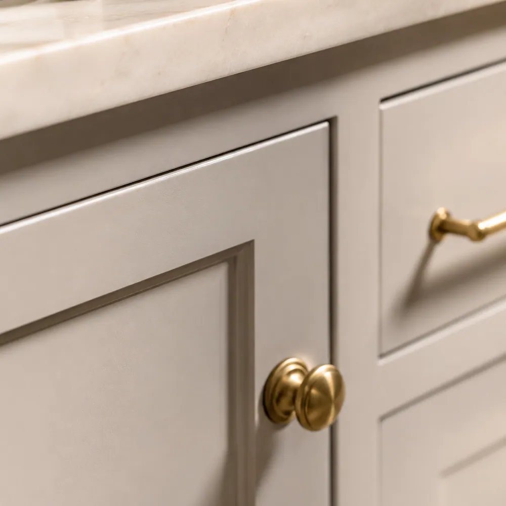 Close view of a Shaker-style door and hardware detail.